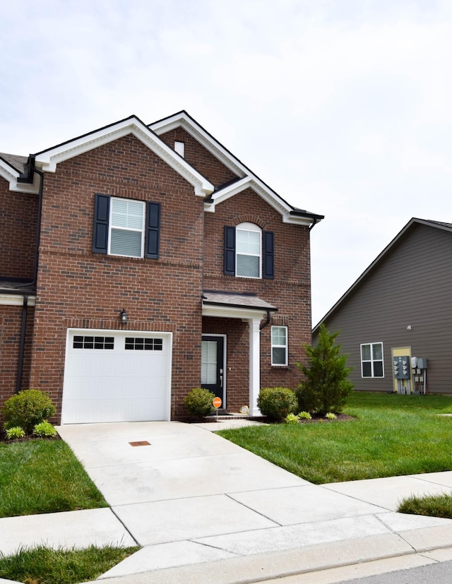 traditional-style home with an attached garage, brick siding, driveway, and a front yard