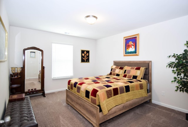 bedroom with baseboards and carpet flooring