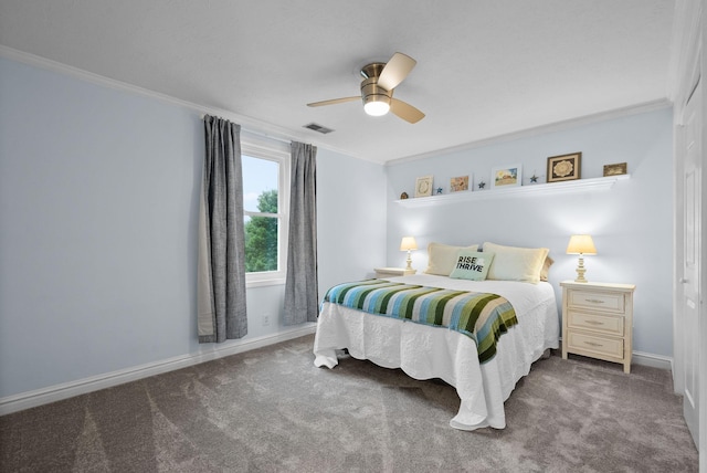 carpeted bedroom featuring ceiling fan, baseboards, crown molding, and visible vents