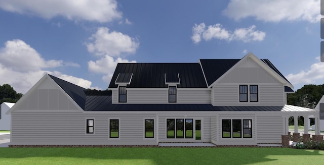 rear view of property with a yard and a standing seam roof