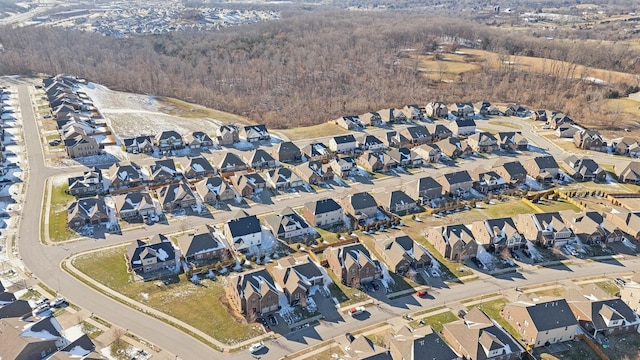 drone / aerial view with a view of trees and a residential view