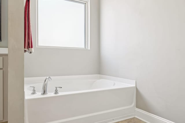 bathroom featuring a bath
