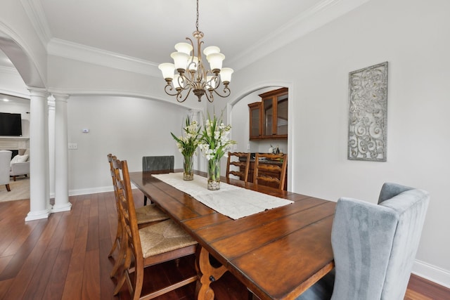 132 Thornwood Pl, Hendersonville, TN 37075 - dining space featuring arched walkways, dark wood-type flooring, and crown molding