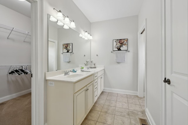 132 Thornwood Pl, Hendersonville, TN 37075 - bathroom with a walk in closet, tile patterned floors, a sink, and double vanity