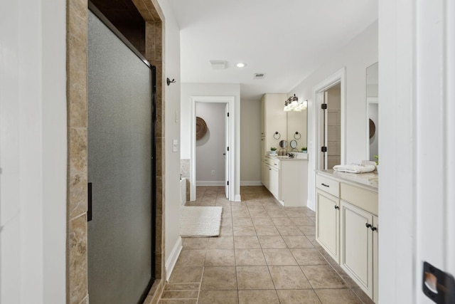 132 Thornwood Pl, Hendersonville, TN 37075 - bathroom featuring tile patterned floors, visible vents, two vanities, and a stall shower