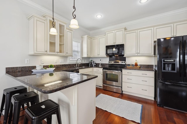132 Thornwood Pl, Hendersonville, TN 37075 - kitchen with a peninsula, a sink, glass insert cabinets, black appliances, and cream cabinets