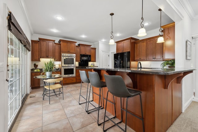 132 Thornwood Pl, Hendersonville, TN 37075 - kitchen with crown molding, a kitchen breakfast bar, brown cabinetry, black appliances, and a peninsula