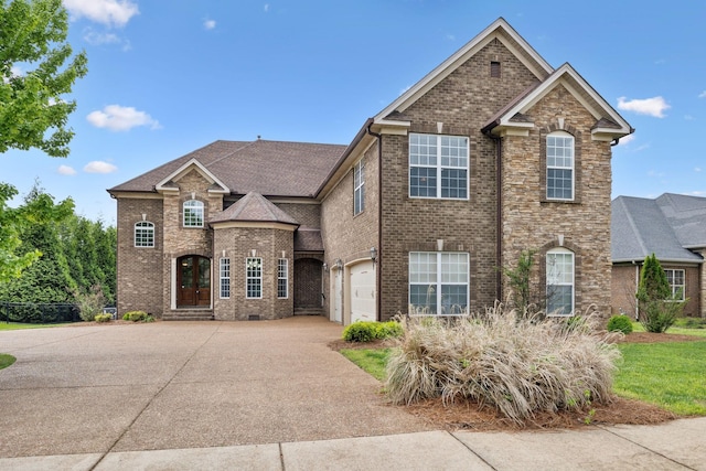 132 Thornwood Pl, Hendersonville, TN 37075 - traditional-style house featuring a garage, brick siding, and concrete driveway