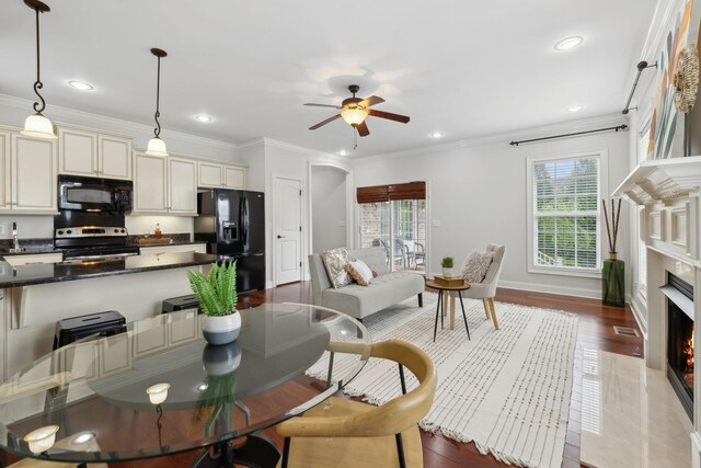 132 Thornwood Pl, Hendersonville, TN 37075 - living room featuring dark wood-style floors, recessed lighting, a ceiling fan, crown molding, and a fireplace