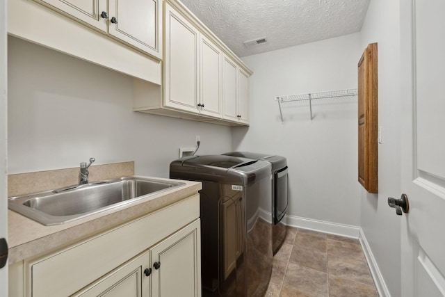132 Thornwood Pl, Hendersonville, TN 37075 - laundry room with a sink, washing machine and dryer, baseboards, visible vents, and cabinet space