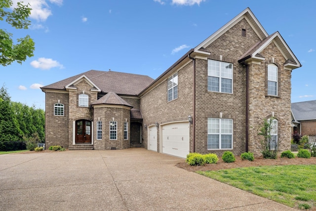 132 Thornwood Pl, Hendersonville, TN 37075 - traditional home with driveway, brick siding, and a garage
