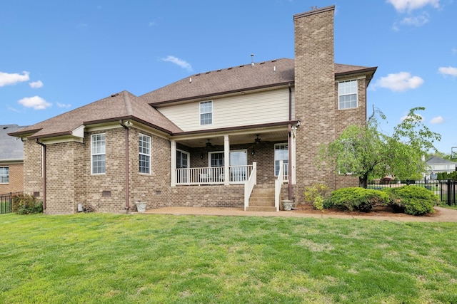 132 Thornwood Pl, Hendersonville, TN 37075 - back of property featuring a yard, ceiling fan, brick siding, and fence