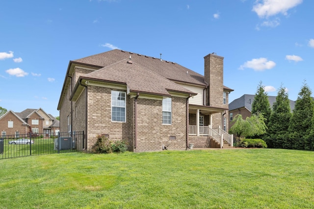 132 Thornwood Pl, Hendersonville, TN 37075 - rear view of house with fence, a chimney, brick siding, and a yard