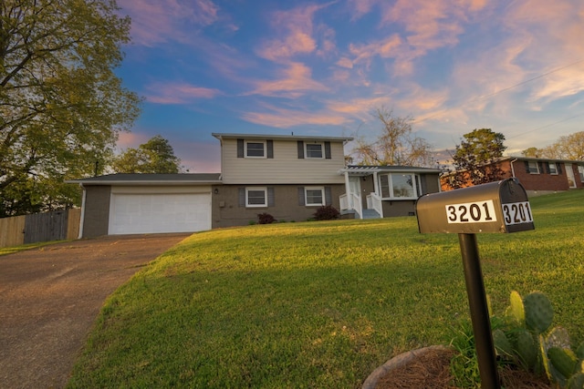 3201 Healy Dr, Nashville, TN 37207 - tri-level home with a garage, a front lawn, concrete driveway, and fence
