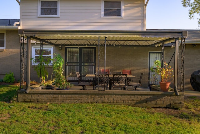 3201 Healy Dr, Nashville, TN 37207 - rear view of house with a patio area, a yard, and brick siding