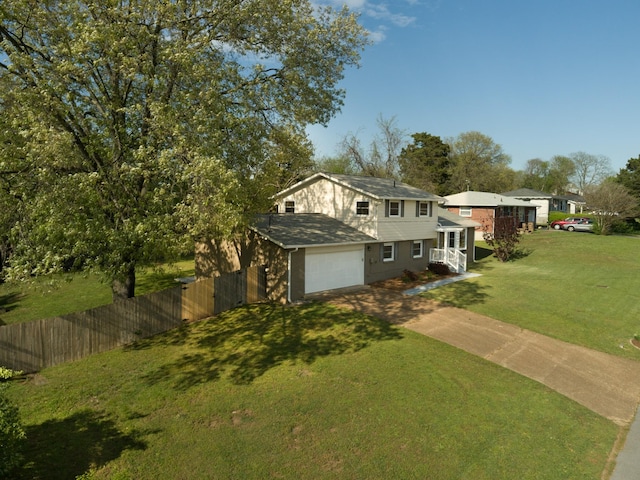 3201 Healy Dr, Nashville, TN 37207 - split level home with a front yard, concrete driveway, and fence