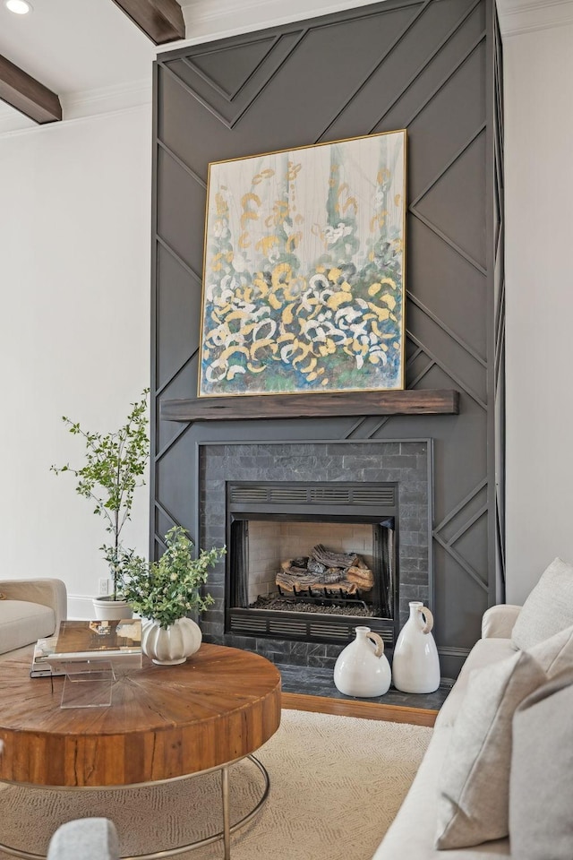 details featuring recessed lighting, crown molding, and a large fireplace