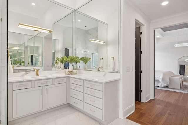 ensuite bathroom featuring crown molding, vanity, walk in shower, ensuite bath, and recessed lighting