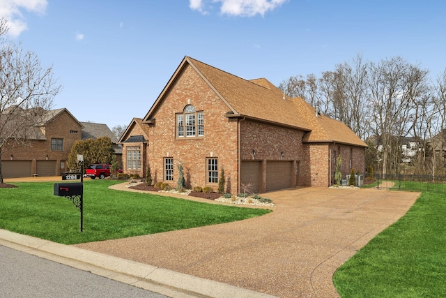 view of property exterior with fence, roof with shingles, concrete driveway, a lawn, and brick siding