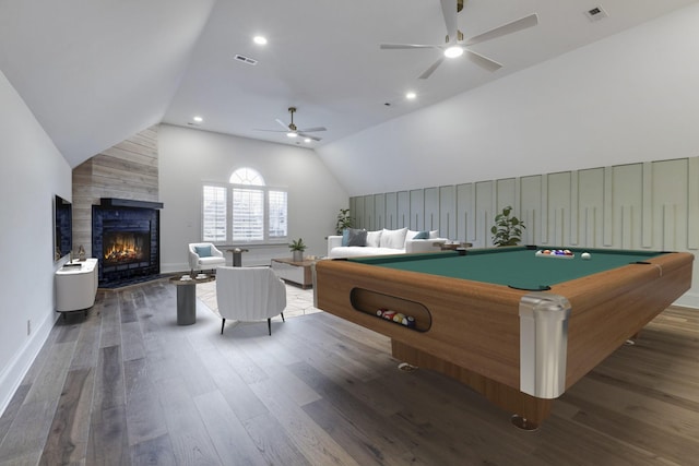 playroom with ceiling fan, vaulted ceiling, wood finished floors, and visible vents