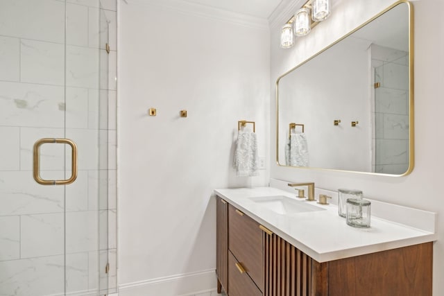 bathroom with a shower stall, baseboards, crown molding, and vanity