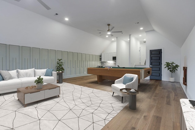 interior space with recessed lighting, lofted ceiling, a ceiling fan, light wood-style floors, and pool table