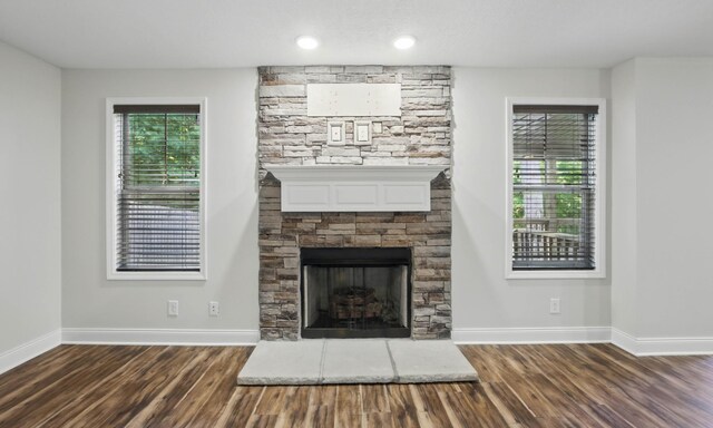 1200 Eagles Bluff Dr, Clarksville, TN 37040 - unfurnished living room featuring wood finished floors, baseboards, and a fireplace