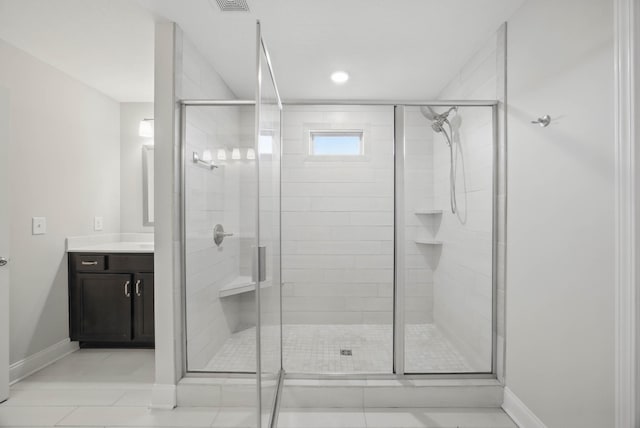 1200 Eagles Bluff Dr, Clarksville, TN 37040 - bathroom featuring baseboards, vanity, a shower stall, and tile patterned floors