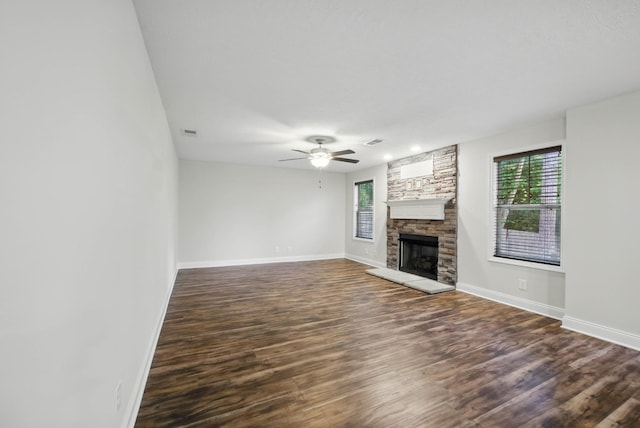 1200 Eagles Bluff Dr, Clarksville, TN 37040 - unfurnished living room with baseboards, dark wood-style flooring, a fireplace, and ceiling fan