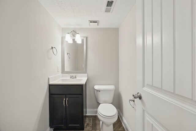 1200 Eagles Bluff Dr, Clarksville, TN 37040 - half bathroom with toilet, vanity, and baseboards