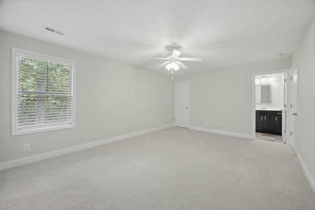 1200 Eagles Bluff Dr, Clarksville, TN 37040 - unfurnished bedroom featuring baseboards, light carpet, and connected bathroom