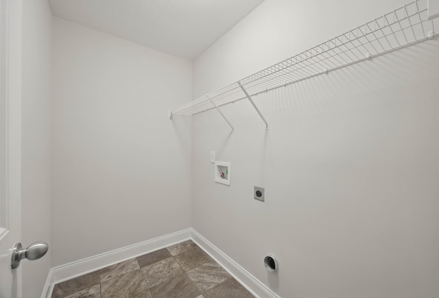 1200 Eagles Bluff Dr, Clarksville, TN 37040 - washroom featuring washer hookup, hookup for an electric dryer, baseboards, and dark stone finish floors