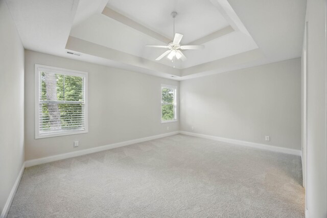 1200 Eagles Bluff Dr, Clarksville, TN 37040 - carpeted spare room with a tray ceiling, baseboards, and a ceiling fan