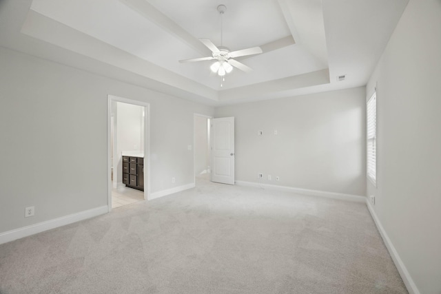 1200 Eagles Bluff Dr, Clarksville, TN 37040 - unfurnished bedroom featuring a raised ceiling, light carpet, baseboards, and connected bathroom