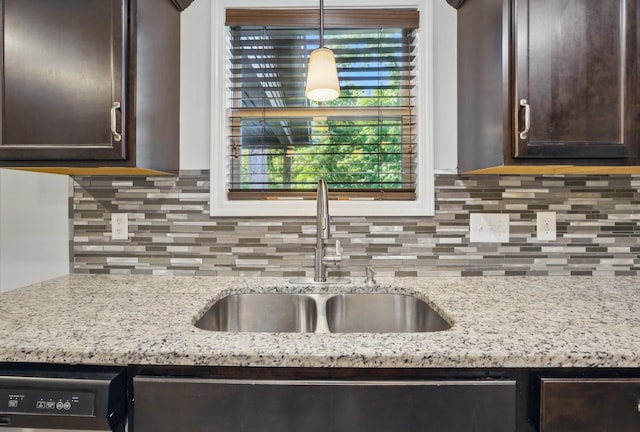 1200 Eagles Bluff Dr, Clarksville, TN 37040 - kitchen with a sink, dark brown cabinetry, tasteful backsplash, and healthy amount of natural light