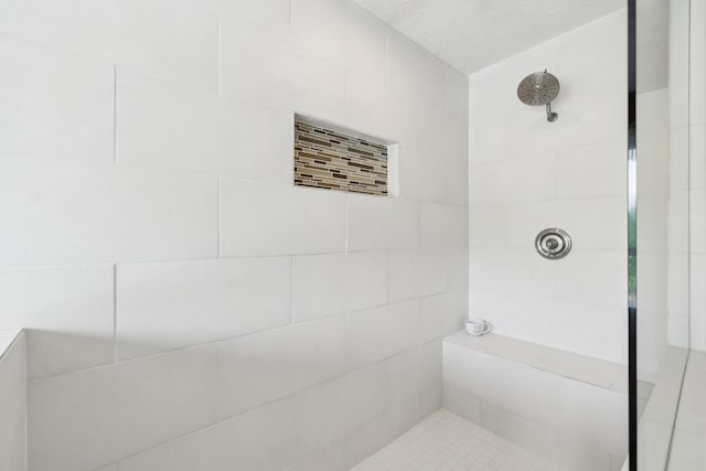 full bathroom with tiled shower