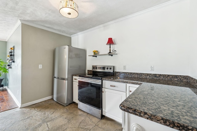 kitchen with dark countertops, stone tile floors, ornamental molding, and stainless steel appliances