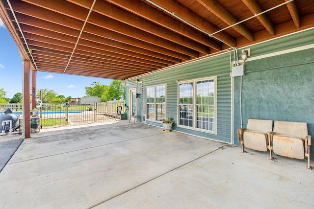 view of patio / terrace with a fenced in pool and fence