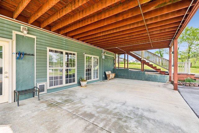 view of patio featuring stairway