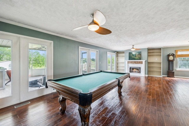 game room featuring a ceiling fan, hardwood / wood-style floors, a textured ceiling, french doors, and visible vents