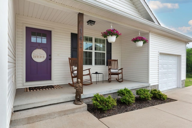 142 Sun Rise Rdg, Pulaski, TN 38478 - property entrance featuring covered porch, an attached garage, and driveway