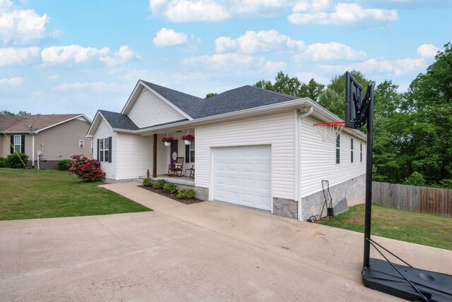 142 Sun Rise Rdg, Pulaski, TN 38478 - ranch-style house featuring a porch, fence, a front lawn, concrete driveway, and an attached garage