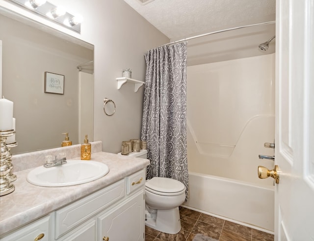 bathroom featuring shower / bath combination with curtain, a textured ceiling, vanity, and toilet