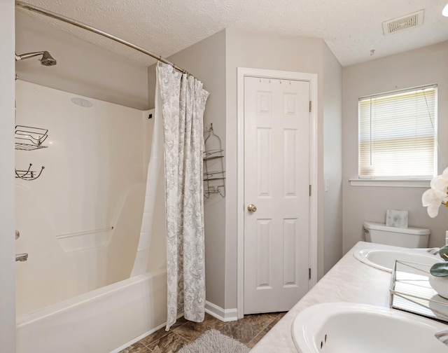 full bathroom featuring a textured ceiling, visible vents, shower / bath combo, and a sink