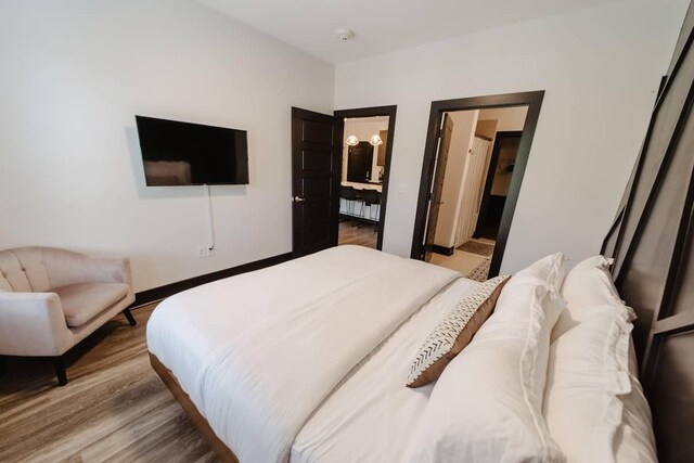 bedroom featuring wood finished floors