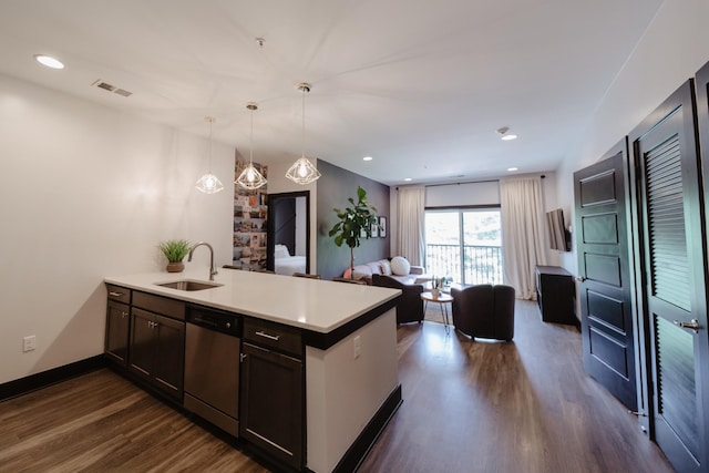 kitchen featuring stainless steel dishwasher, a sink, open floor plan, a peninsula, and dark wood-style floors