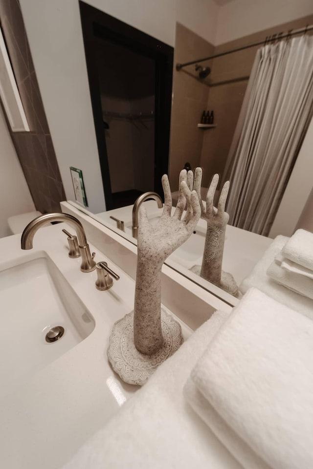 full bathroom with a shower with shower curtain and vanity