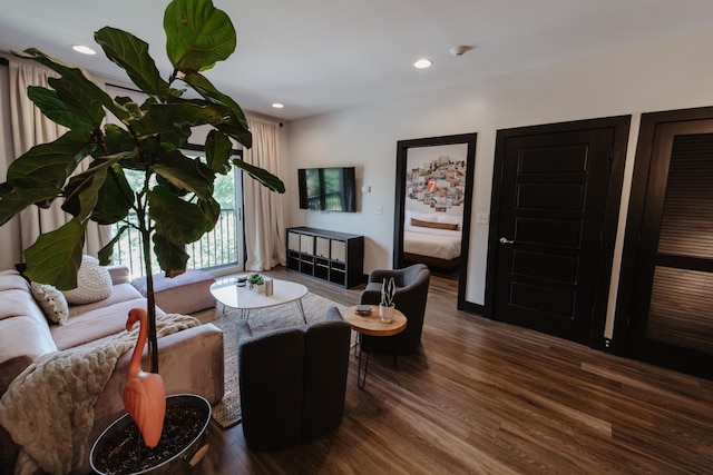 living room with wood finished floors and recessed lighting