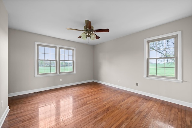 13391 Fruit Hill Red Bridge Rd, Crofton, KY 42217 - empty room featuring baseboards, wood finished floors, visible vents, and ceiling fan