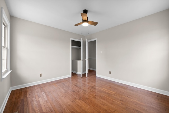 13391 Fruit Hill Red Bridge Rd, Crofton, KY 42217 - unfurnished bedroom with baseboards, wood finished floors, a closet, and ceiling fan